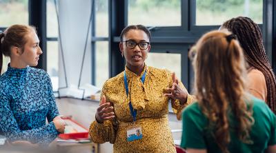 For organizations - societies Students learning from a teacher